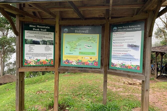 Interpretive boards at Holywell showing the Blue Mountain Peak trail and a park map